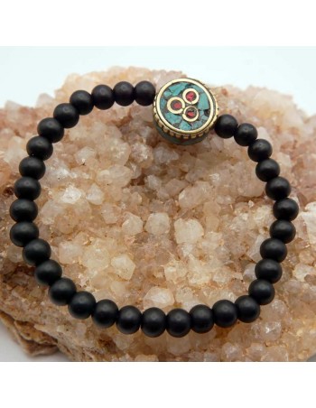 Pulsera de Cuentas de Piedra Natural Shalingram con Dije Tibetano: Armonía y Equilibrio para tu Espíritu